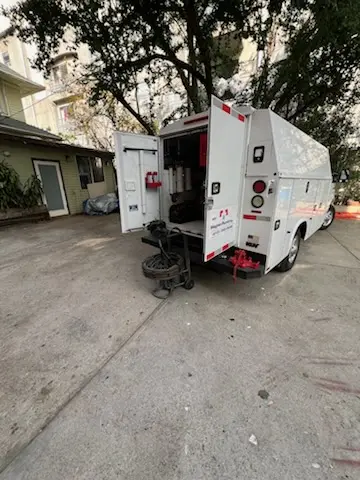 Magnet Plumbing service vehicle on-site for Grease Trap Cleaning in Seminole Heights East